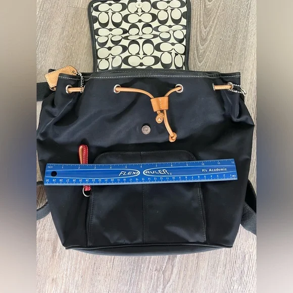 COACH canvas backpack and COACH leather wallet.